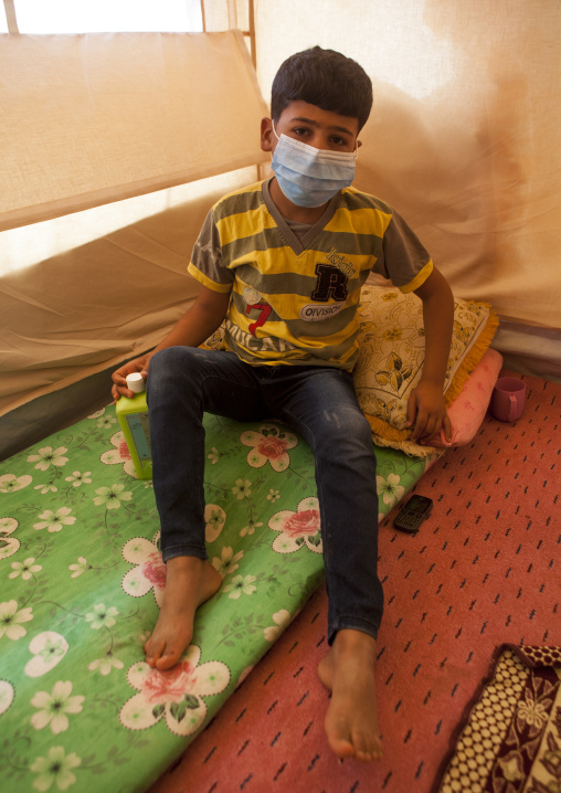 Ill Young Boy With A Mask In A Syrian Refugee Camp, Erbil, Kurdistan, Iraq