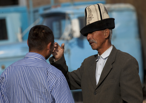 Men Chatting At The Animal Market Of Kochkor, Kyrgyzstan