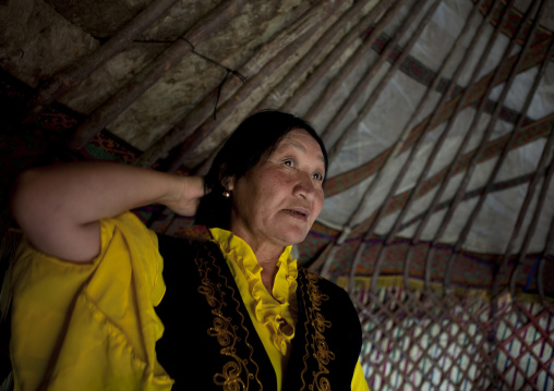 Woman In Traditional Dress In Her Yurt, Jailoo, Kyrgyzstan