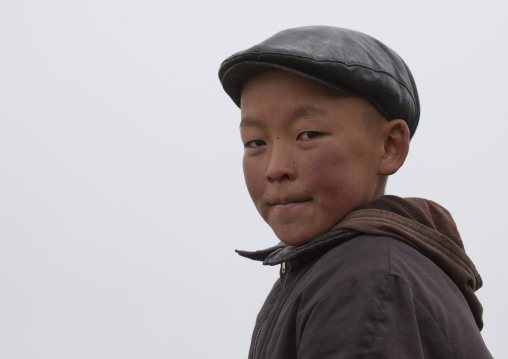 Boy With A Cap In Saralasaz Jailoo, Kyrgyzstan
