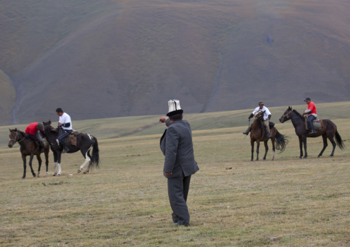 Old Man With Kalpak Hat Giving Instructions During Horse Game, Saralasaz Jailoo Area, Kyrgyzstan