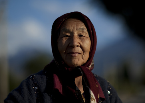 Old Woman With Headscarf In Kochkor, Kyrgyzstan
