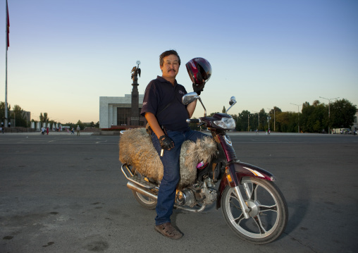 Man On A Motorobike With A Saddle Made Of A Sheep Skin, Bishkek, Kyrgyzstan