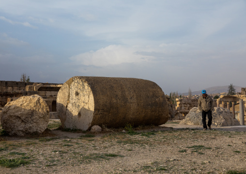 Antique pillar lying on the ground at the archeological site, Beqaa Governorate, Baalbek, Lebanon