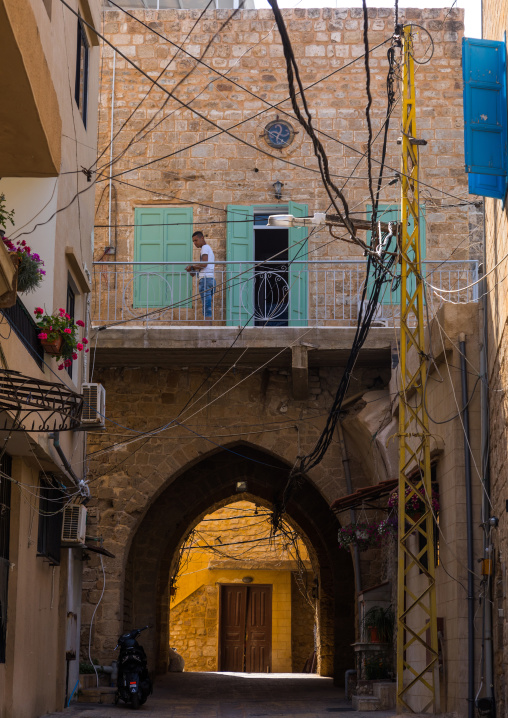 Lebanese man on the balcony of his traditonal house in the old city, South Governorate, Tyre, Lebanon