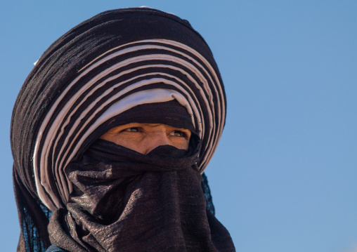 Portrait of a tuareg man  in traditional clothing against the sky, Tripolitania, Ghadames, Libya