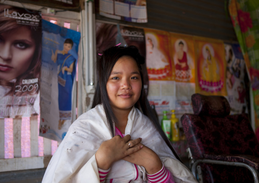 Teenager in a hairdresser, Pakse, Laos