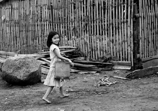 Alak girl with a basket, Boloven, Laos
