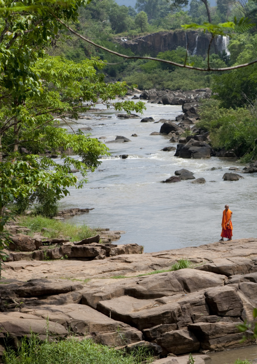 Monk in tadfan waterfalls, Boloven, Laos