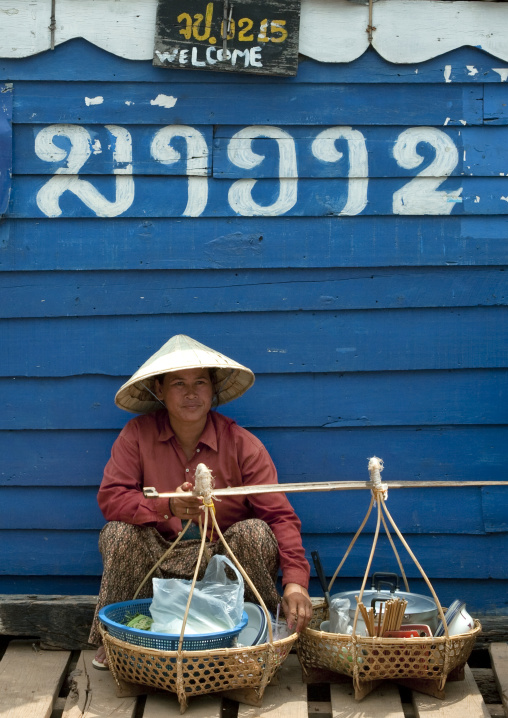 Market seller on mekong river, Phonsaad, Laos