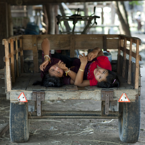 Bru minority teenagers resting in a cart, Phonsaad, Laos