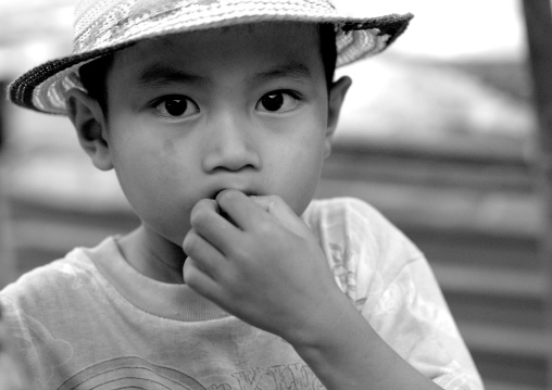 Lao boy with a hat, Pakse, Laos