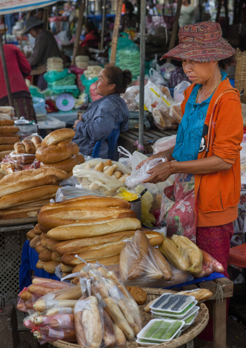 Woman selling french baguettes bread, Pakse, Laos