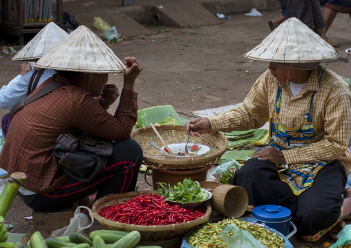 Women selling food on a market, Pakse, Laos