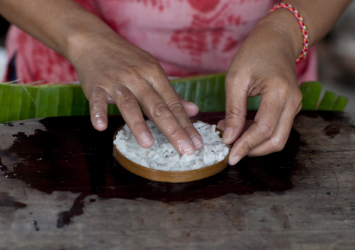 Khmu minority woman making rice, Houei xay, Laos