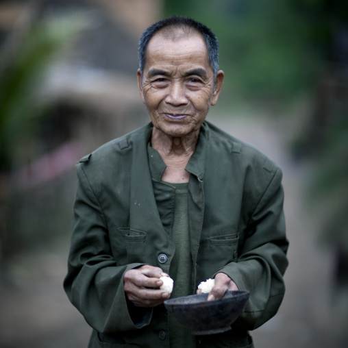 Khmu minority old man eating rice, Xieng khouang, Laos