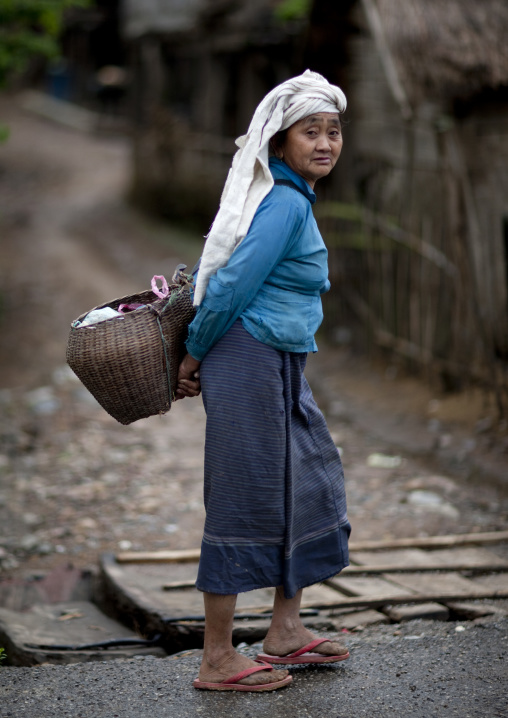 Thai kaho minority woman with a basket, Ban sam kang, Laos