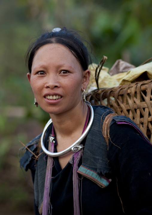 Lantaen minority woman carrying a basket, Nam deng, Laos