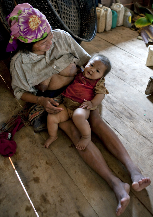 Akha minority breastfeeding mother and baby, Ban ta mi, Laos