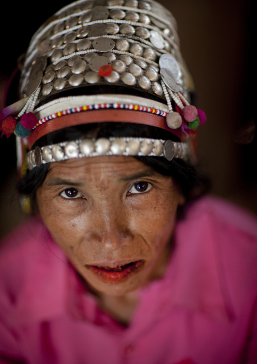 Akha minority woman with traditional headdress, Ban ta mi, Laos