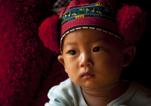 Yao minority kid with traditional hat, Ban xay leck, Laos