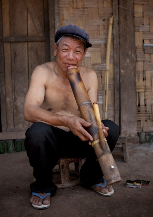 Ho minority shaman smoking, Louang namtha, Laos