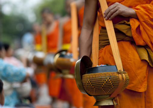 Lao buddhist monks collecting alms, Luang prabang, Laos