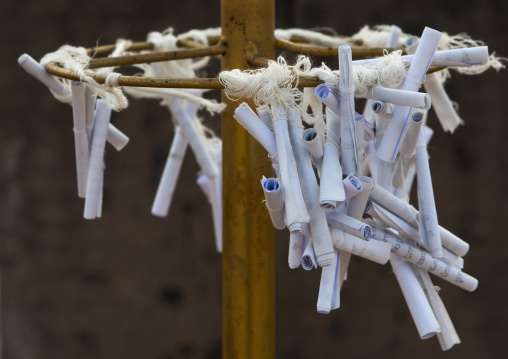Papers to make wishes in a temple, Thakhek, Laos