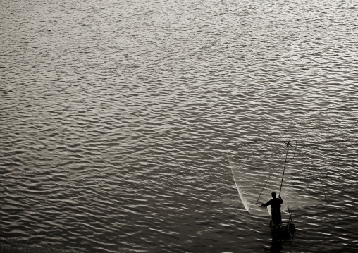 Fisherman on mekong river, Thakhek, Laos