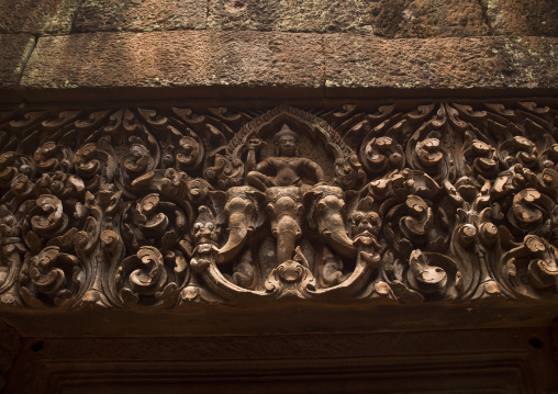 Detail of carvings on lintel above entrance to upper level sanctuary of wat phu, Champasak, Laos