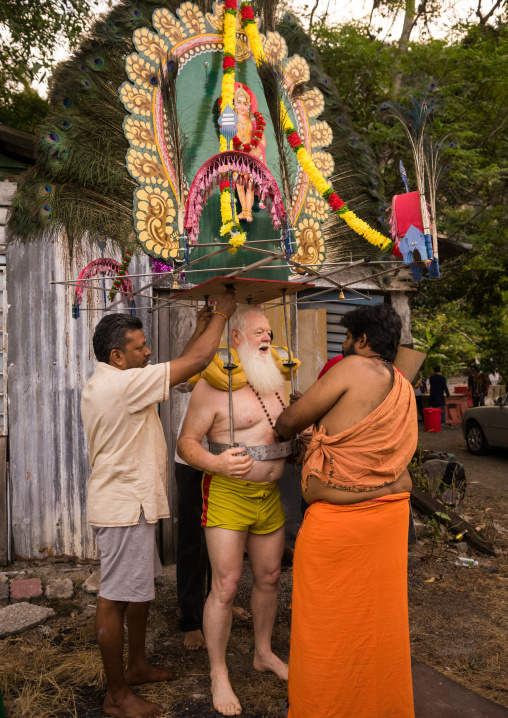 Devotee Kavadi Australian Bearer With Tongue Piercing At Thaipusam Hindu Religious Festival In Batu Caves, Southeast Asia, Kuala Lumpur, Malaysia