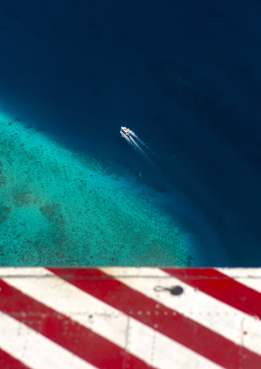 Seaplane Flying Over An Atoll And A Speed Boat, Male, Maldives