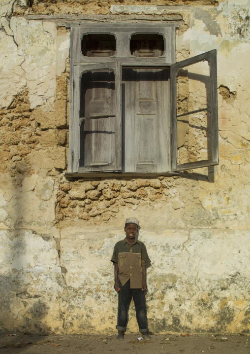Kid Standing In Front Of An Old Window, Ibo Island, Cabo Delgado Province, Mozambique