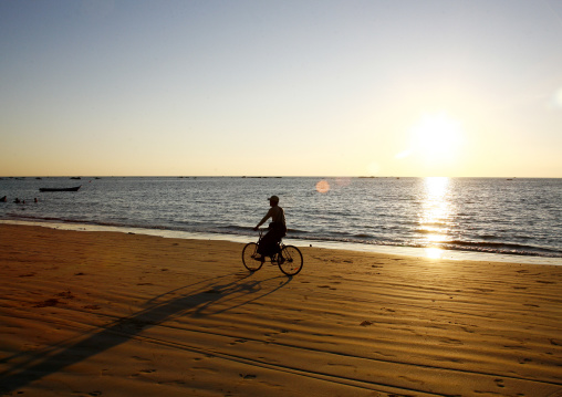 Man On A Bike In Ngapali Beach, Myanmar