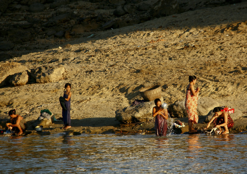 Women Taking Bath On Irrawaddy River Banks, Myanmar