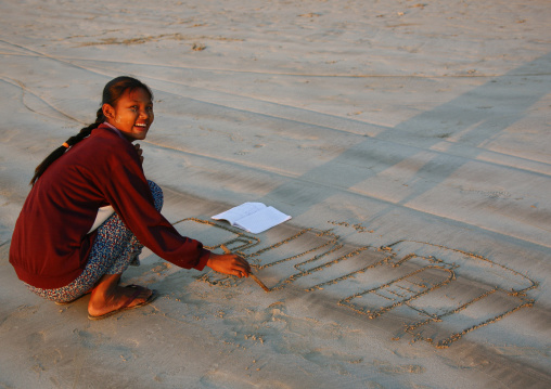 Student Doing School Execices On Sand, Ngapali, Myanmar