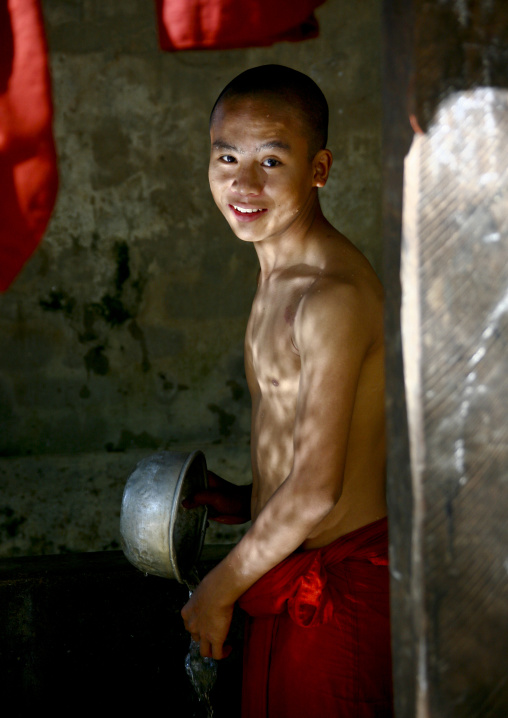 Novice Buddhist Monk Taking A Bath, Rangoon, Myanmar