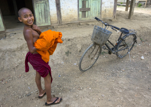 Young Novice Monk With His Bicycle, Mrauk U, Myanmar