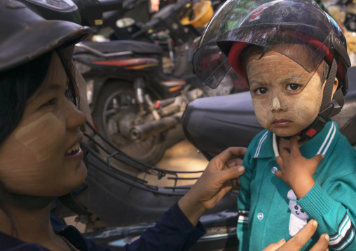 Mother Putting A Helmet To Her Child, Bagan, Myanmar