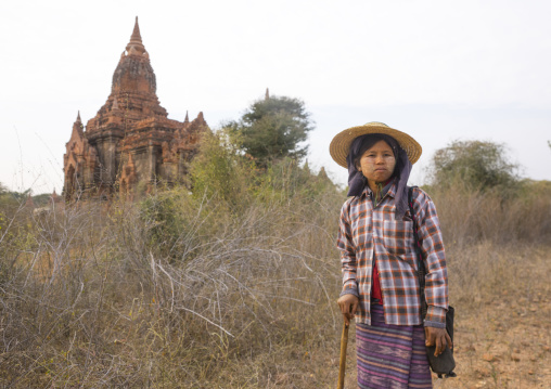 Sheperd Woman In Front Of An Old Temple, Bagan, Myanmar