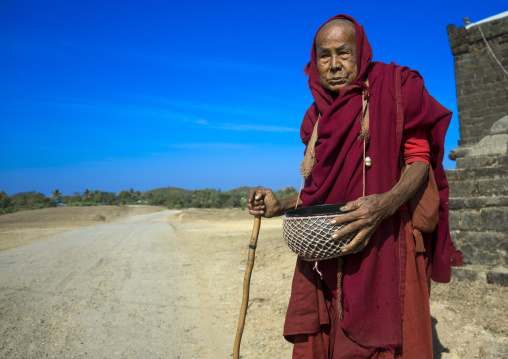 Old Monk Begging For Food On A Road, Mrauk U, Myanmar