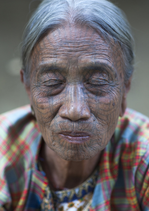 Tribal Chin Woman With Spiderweb Tattoo On The Face And Closed Eyes, Mrauk U, Myanmar