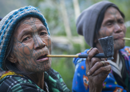 Tribal Chin Women From Muun Tribe With Tattoos On The Face Smoking, Mindat, Myanmar