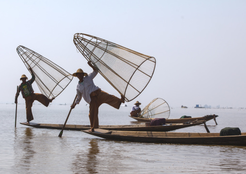 Traditional Fishermen With Fish Trap In Boat, Inle Lake, Myanmar