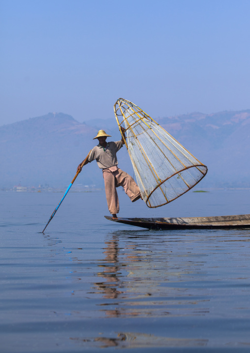 Traditional Fisherman With Fish Trap In Boat, Inle Lake, Myanmar