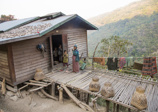Chin Family In A Typical Bamboo House In The Hills, Mindat, Myanmar