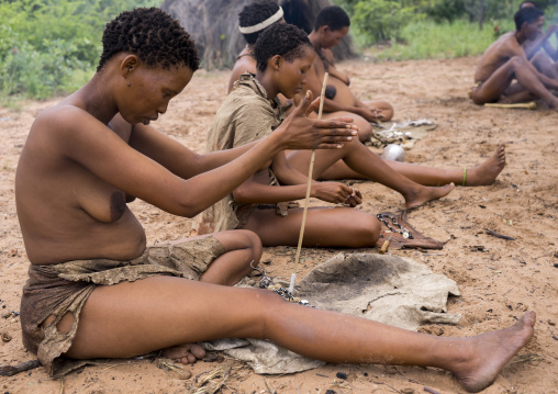 Bushman Women Making Necklaces With Ostrich Eggs Shells, Tsumkwe, Namibia