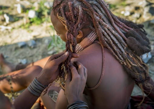 Himba Woman Making Dreadlocks On Her Friend, Epupa, Namibia