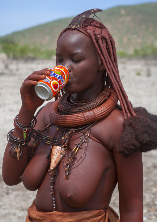 Bare Breasted Himba Woman Drinking Fanta, Epupa, Namibia