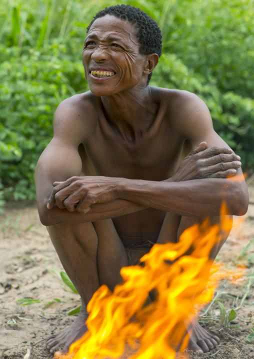 Busman In Front Of A Fire, Tsumkwe, Namibia